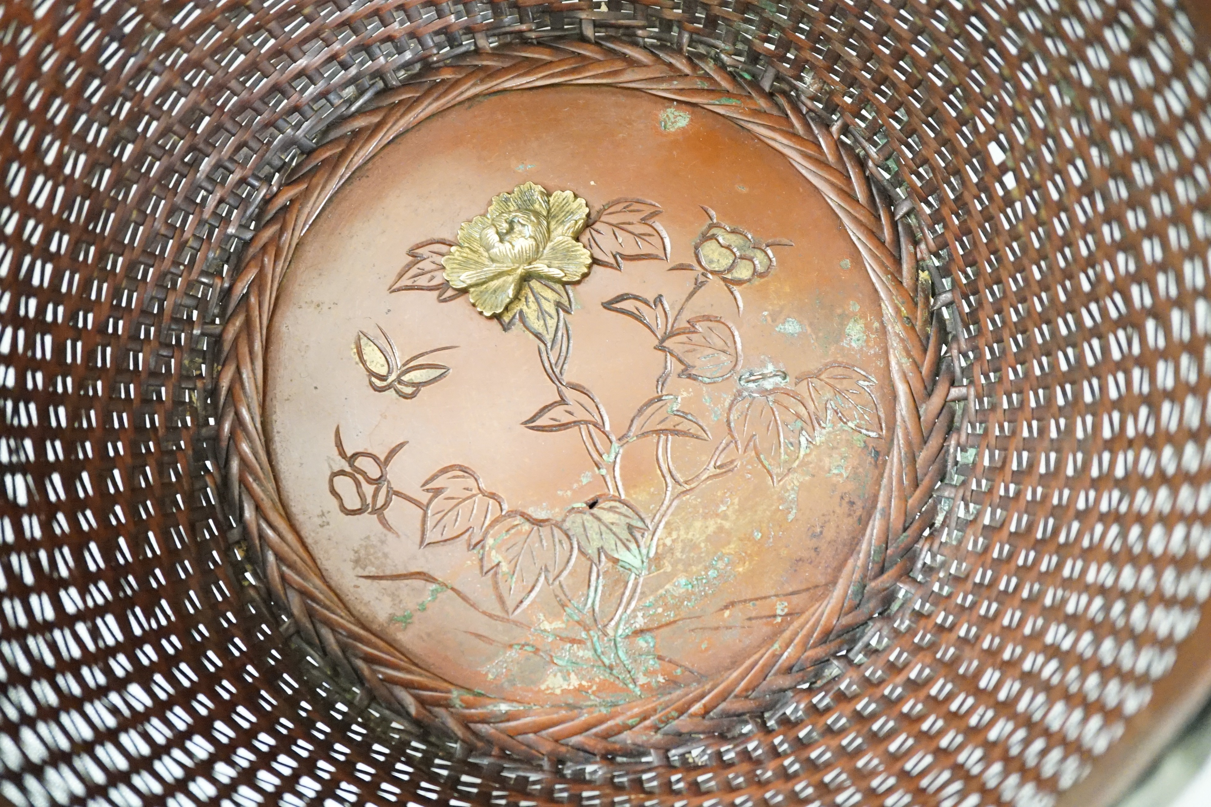 A Japanese Meiji period polished bronze dish, two hanging scroll weights, a mixed metal basket and a pair of bronze vases, dish diameter 37cm